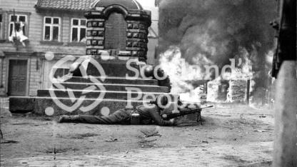 A gunner takes cover during the battle for the Rhine April 1945