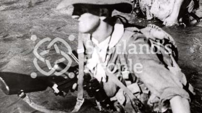 British soldiers fording river in Burma, 1944