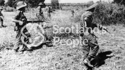 British soldiers advancing through countryside in South East Asia, c 1944-1945