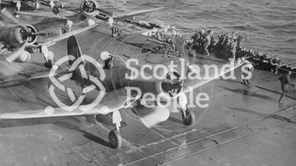 Fighter bomber taking off from carrier, 1944
