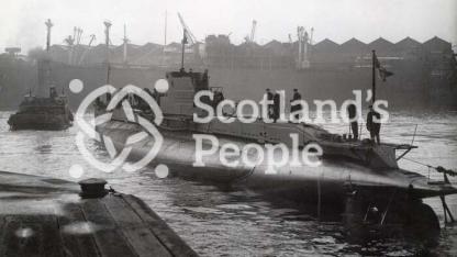 Submarine in shipyard basin, c 1944