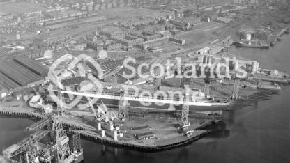 Aerial view of Queen Elizabeth 2 under construction on Clydebank, 1967