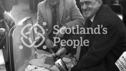 Swedish visitor to Clydebank with QE2 whisky, 1968 (RMS Queen Elizabeth 2)