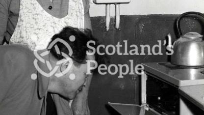 Soviet delegate in miner's home near Alloa, 1960s