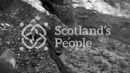 Boy on coal bing, Fife, 1935