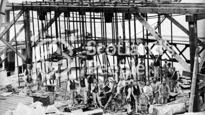 Workers by Forth Bridge pier during construction, 1884