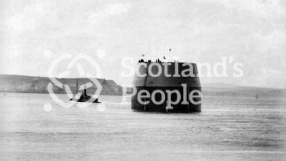 Forth Bridge caisson towed by tug, 1885