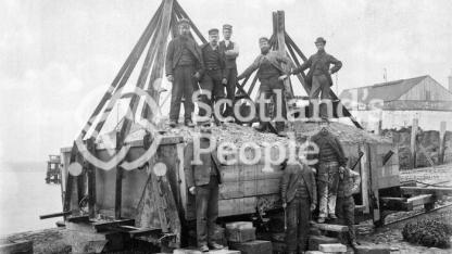 Forth Bridge workers on mooring block, 1885