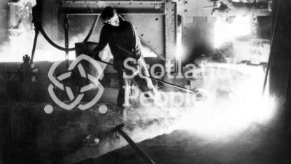 Workman with ladle at Carron Works, 20th century