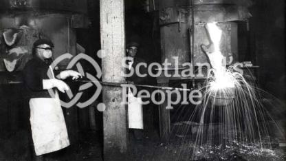 Workmen filling ladle at Carron Works, 20th century