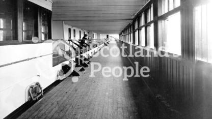 Cunard Line ocean liner RMS Aquitania: view of the 1st Class Promenade B Deck looking aft, 1913