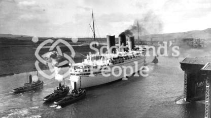 The Canadian Pacific Line ocean liner the RMS Empress of Britain on the River Clyde leaving Clydebank