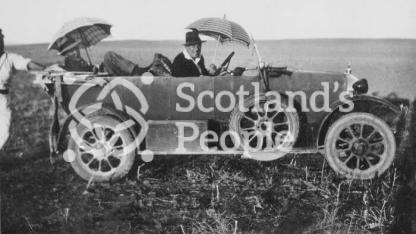 Robert Stewart-Peter in his motor car 'Florrie' with 'Fanny Adams' near Mosul, Northern Iraq, 1926