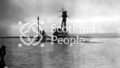 The German Derfflinger Class battlecruiser SMS Hindenburg half submerged at Scapa Flow after being scuttled on 21 June 1919