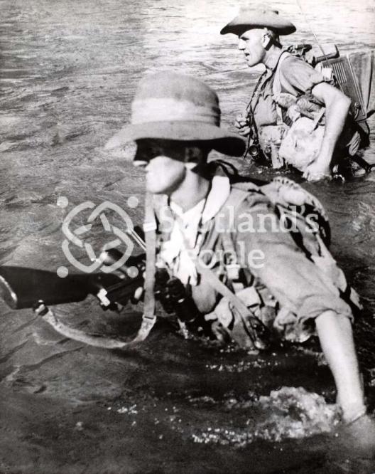 British soldiers fording river in Burma, 1944