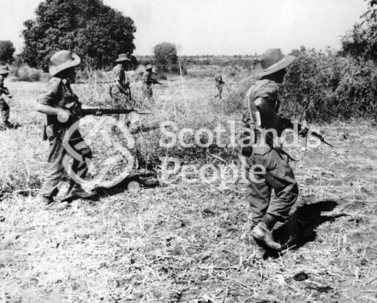 British soldiers advancing through countryside in South East Asia, c 1944-1945