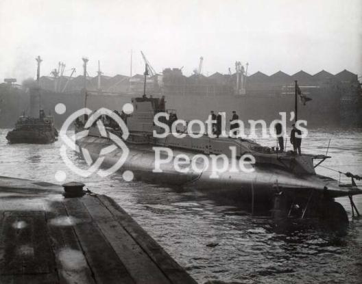 Submarine in shipyard basin, c 1944