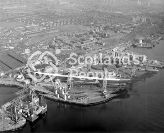 Aerial view of Queen Elizabeth 2 under construction on Clydebank, 1967
