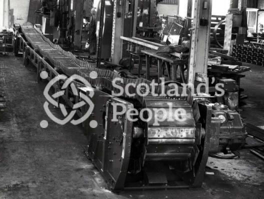Conveyor belt in workshop, 1960s