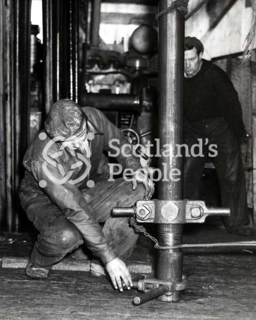 Men working on a boring tower in the Forth, 1955