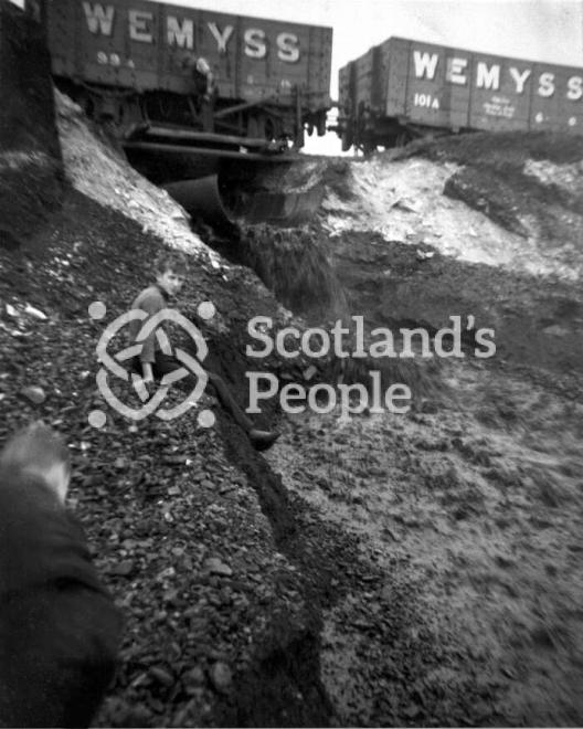Boy on coal bing, Fife, 1935