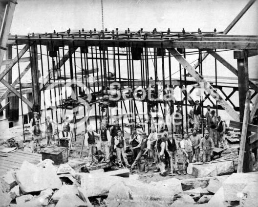 Workers by Forth Bridge pier during construction, 1884