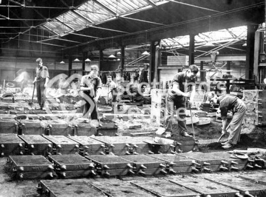 Workmen lining moulds at Carron Works, 20th century