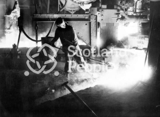 Workman with ladle at Carron Works, 20th century