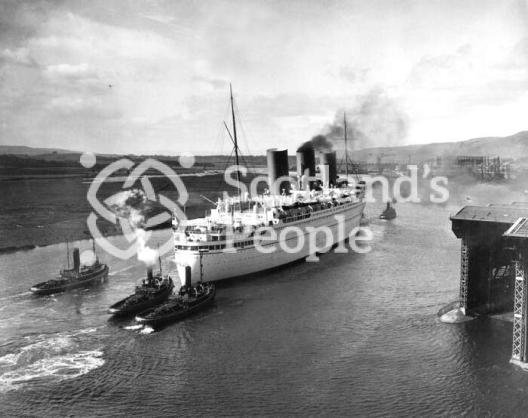 The Canadian Pacific Line ocean liner the RMS Empress of Britain on the River Clyde leaving Clydebank