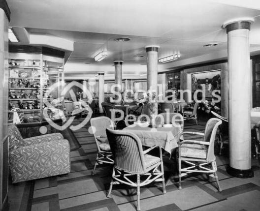 The Third Class Garden Lounge looking to port on board the Cunard Line ocean liner RMS Queen Mary
