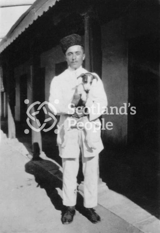 'James, my Assyrian bearer and Boggins the Bolshevik pup'