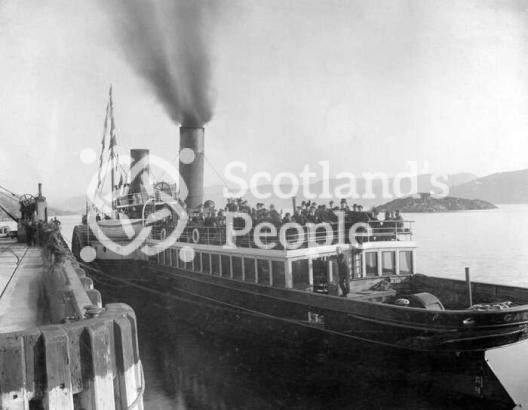 A paddle steamer at Kyle of Lochalsh pier about to sail to Skye
