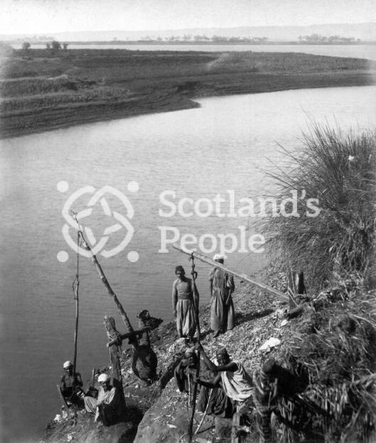 Egyptian farmers extracting water from the Nile to irrigate their fields in Luxor, Shadouf
