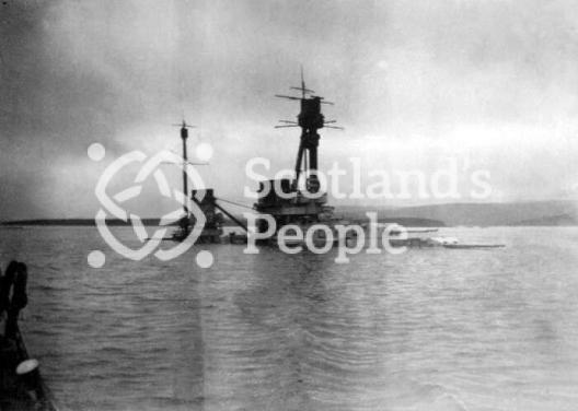 The German Derfflinger Class battlecruiser SMS Hindenburg half submerged at Scapa Flow after being scuttled on 21 June 1919
