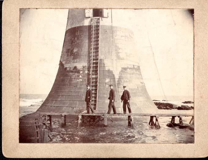 Three Lightkeepers outside of The Bell Rock Lighthouse. One is believed to be John Henderson (1864-1939), c1900-1919.&nbsp;Courtesy of the Morrison Family.